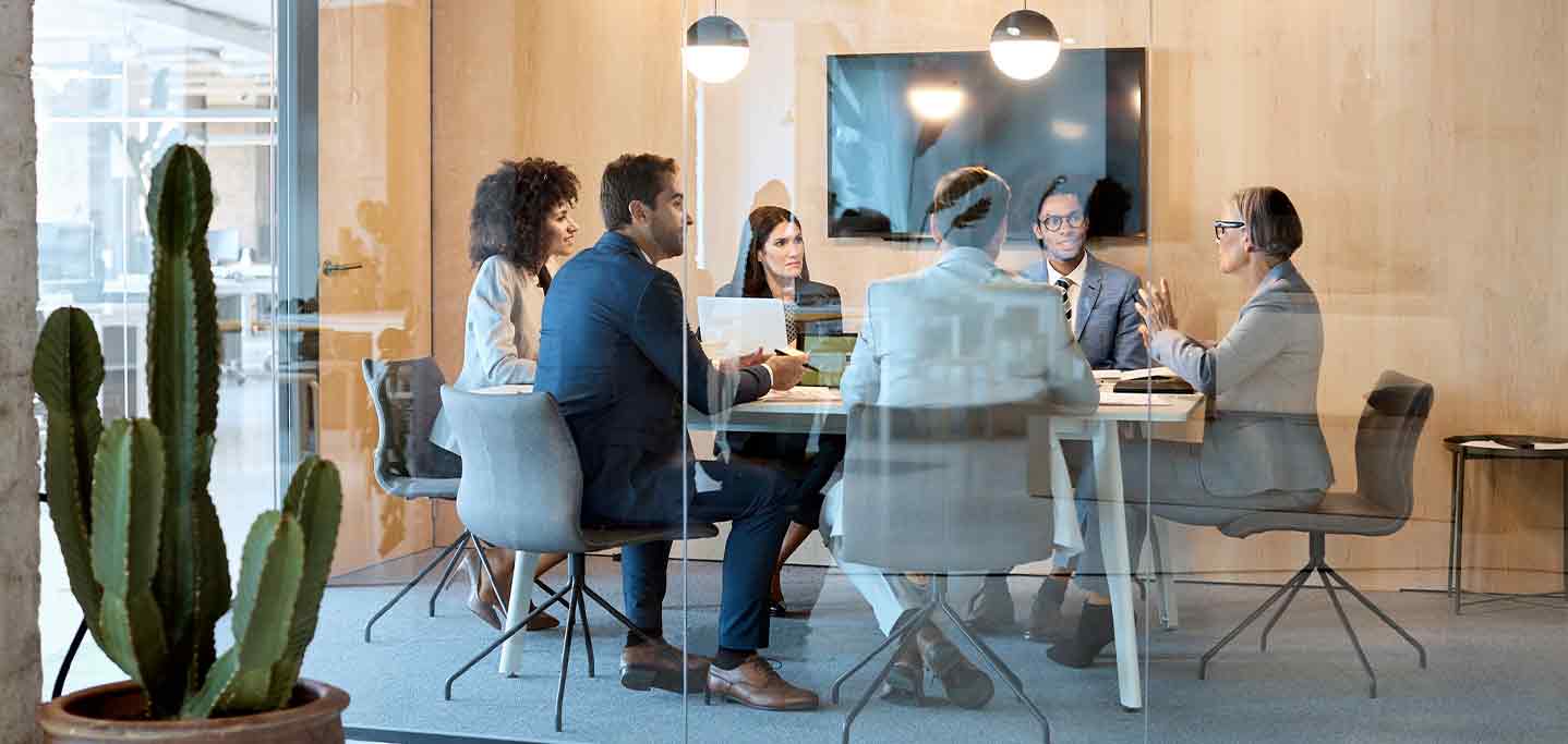 Team Meeting in Glass Wall Conference Room